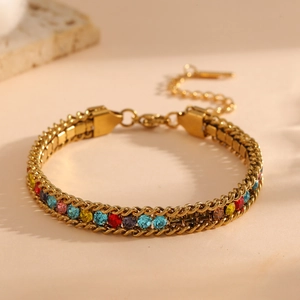 Macro view of gold-plated titanium bracelet with multi-color rhinestones and adjustable chain