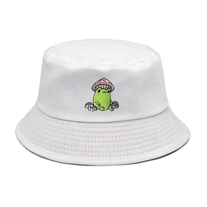 Close-up of cute frog and mushroom embroidery on a white cotton bucket hat
