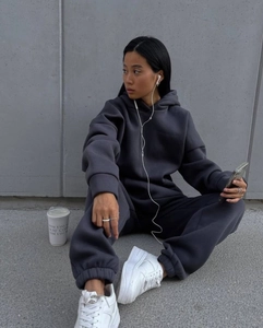 Detail of dark charcoal oversized hoodie and matching joggers in soft cotton fleece