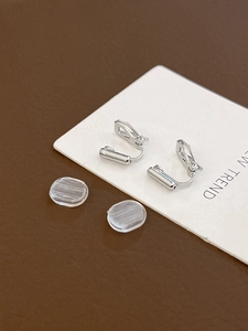 Detail of silver geometric clip-on earring converters with soft silicone comfort pads