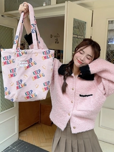 Pink corduroy tote bag with Keep Smiling print and yellow smiley face pattern for women