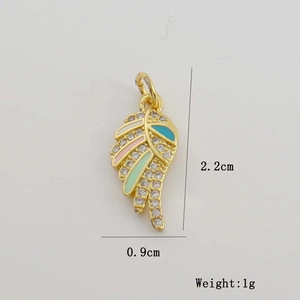 Detail view of 18K gold-plated feather pendant with white zircon and colorful enamel