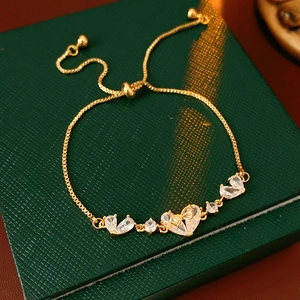 Detail of 18K gold-plated adjustable bracelet with sparkling heart-shaped zircon stones