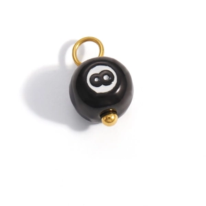 Detail of a black number 8 pool ball pendant with a 18K gold plated stainless steel clasp