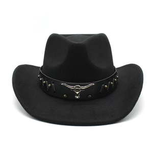 Detail of black wool felt cowboy hat featuring vintage silver bull head and metallic rivets