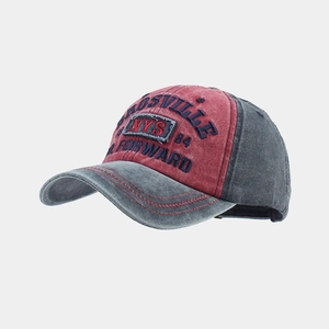 Vintage washed red and grey baseball cap with embroidery, showing a 45-degree angle view