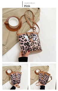 Detailed view of pink leopard bucket bag with leather trim and gold twist lock clasp