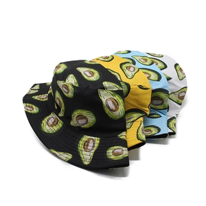 Reversible bucket hat with avocado print in black, yellow, blue, and white cotton fabric