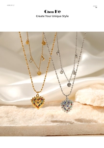 Detail of 14K gold double-layer necklace with colorful gemstones and heart pendant