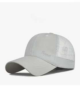 Detail of grey mesh sun cap showing breathable white panels and Sport embroidery