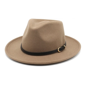 Classic camel wool fedora hat with black leather band and gold buckle on white background