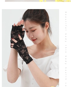 Detail of black floral lace gloves showing breathable mesh and fingerless sun protection