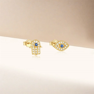 Detailed view of S925 sterling silver evil eye and Hand of Fatima asymmetric studs