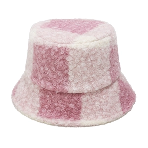 Close-up of pink and white checkered teddy fleece bucket hat for winter warmth