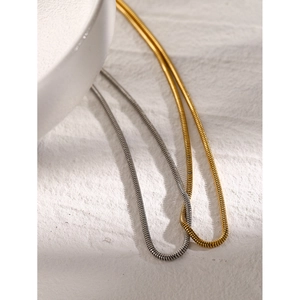 Flat snake bone chain necklace in 18k gold and silver stainless steel minimalist design