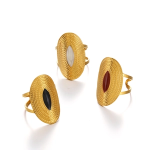 Three gold oval open rings with black, white and red enamel insets on white background