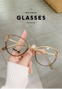 Close-up of cat-eye anti-blue light glasses with brown frames and gold metal temples