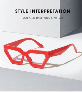 Close-up of red geometric thick-frame glasses with a glossy finish for a trendy look