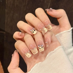 Cat eye press-on nails with pink gradient, 3D pearl bow, and hand-painted kitten art