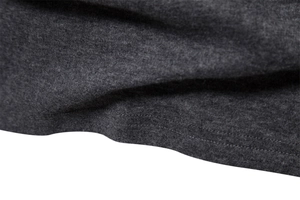 Macro detail of dark grey knit fabric texture and high-quality double stitching on the hem