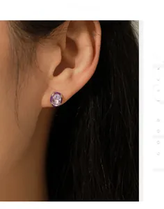 Macro detail of elegant oval lavender zircon stud earring worn by a female model