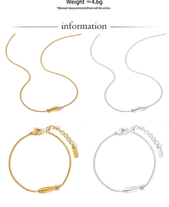 Detail of gold and silver fish pendant necklaces with sparkling rhinestone accents