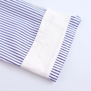 Blue and white striped shirt with contrasting white cuffs and button detail