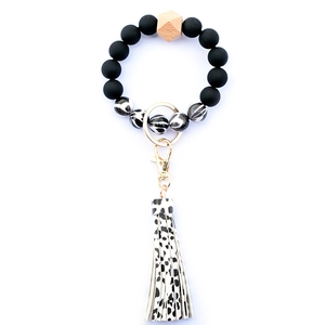 Detail showing silicone beads with leopard print tassel and wooden bead keychain ring