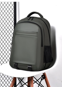 Detail of dark green waterproof backpack with side mesh pocket and adjustable buckle straps