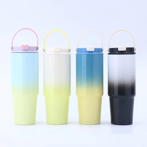 Close-up of four gradient stainless steel tumblers with convenient handles and lids