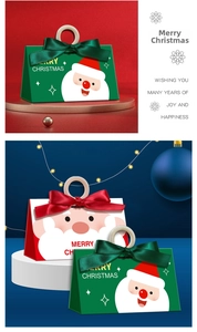 Detailed view of red and green Christmas gift boxes with Santa illustrations and wooden rings