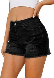 Detail of high-waisted black denim shorts with ripped accents and raw frayed hemline