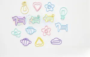 Macro view of macaron-colored shaped paperclips showing heart and animal designs