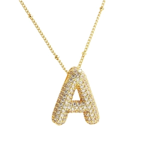 Golden balloon-style letter A pendant necklace with micro-paved cubic zirconia
