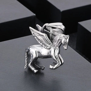Macro shot of silver stainless steel winged Pegasus pendant with detailed texture