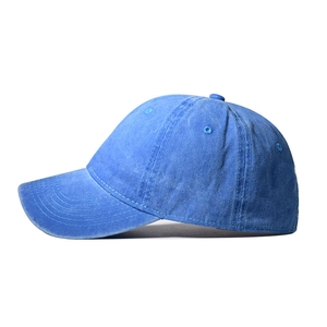 Detail view of washed cotton baseball cap in sky blue with classic six-panel crown and top eyelets