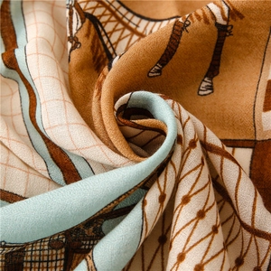 Close-up of luxury linen-touch scarf featuring equestrian print and twill weave texture