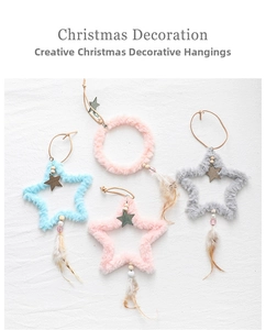 Detail of plush Christmas tree ornaments with wooden beads and soft feathers