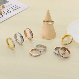 Detailed collection of gold and silver rings with shell inlay and pavé diamonds