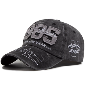Vintage dark gray washed cotton baseball cap with 1985 embroidery and distressed brim