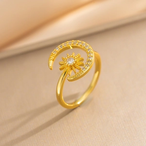 Exquisite gold sun and moon open ring with sparkling zircon stones on silky fabric