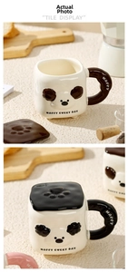 Detail of panda ceramic mug set with lid, showing cream body and chocolate brown accents