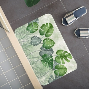 Detail of tropical monstera leaf flannel mat showing soft texture and neat white edges