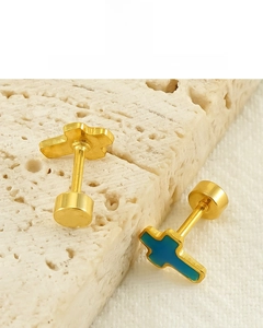 Detail of 18K gold plated titanium cross studs with blue oil drip finish and screw backs