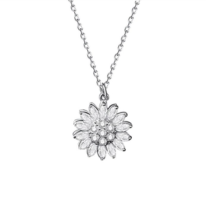 Macro detail of silver sunflower necklace pendant with micro-pave zirconia in close-up view