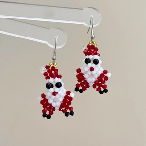 Handmade beaded Santa Claus earrings with festive red and white patterns on metal hooks