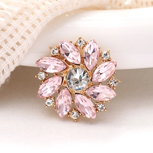 Pink gemstone sunflower charm with crystal accents on golden metal base for DIY decor
