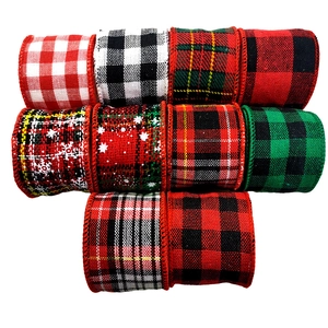 Detailed close-up of 10 assorted Christmas fabric ribbons with snowflake and plaid patterns
