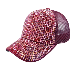 Detailed view of wine red baseball cap featuring gradient beads and breathable mesh
