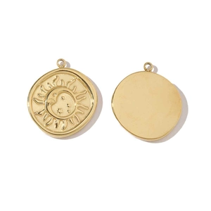 Detail of gold crescent sun and moon relief charms in polished stainless steel